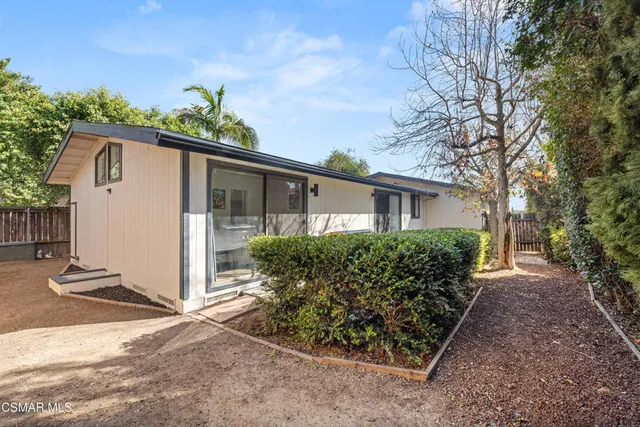 a view of a balcony with wooden floor and stairs