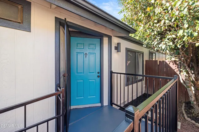 a view of a porch with wooden floor and stairs