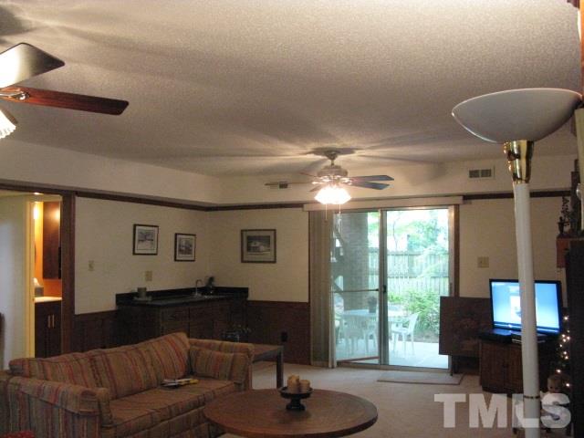 4201 Webster Court Raleigh, NC 27609 - Photo 15 of 25 a living room with furniture and a large window