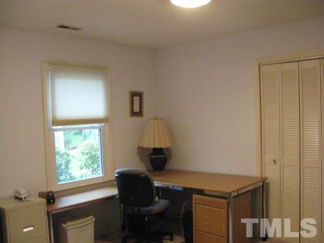 4201 Webster Court Raleigh, NC 27609 - Photo 17 of 25 a workspace with furniture and a window