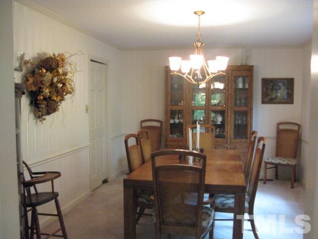 4201 Webster Court Raleigh, NC 27609 - Photo 3 of 25 a dining room with furniture and chandelier kitchen view
