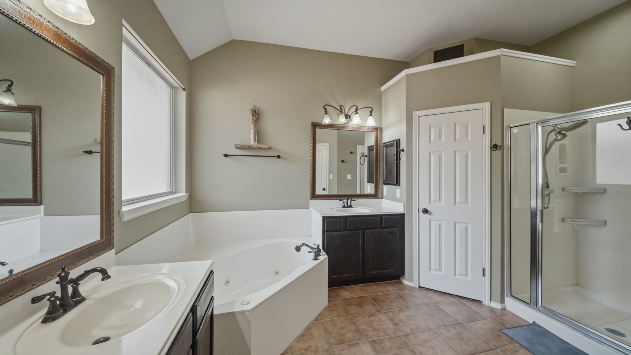 1108 Antelope Ridge Cedar Park, TX 78613 - Photo 10 of 27 Luxurious bathing options await with a corner soaking tub and an adjacent walk-in shower.