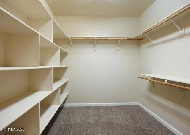a view of an empty walk in closet