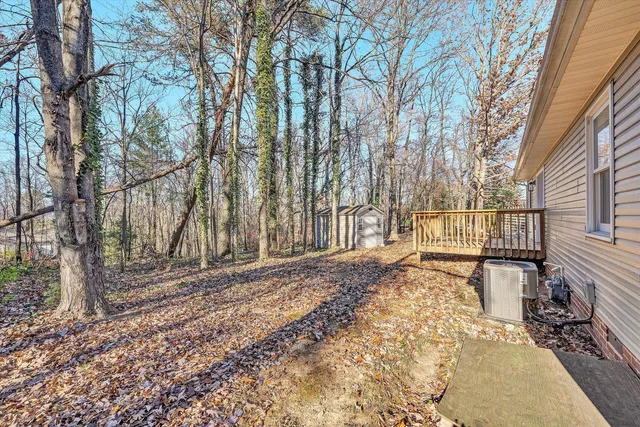 a backyard of a house with lots of green space