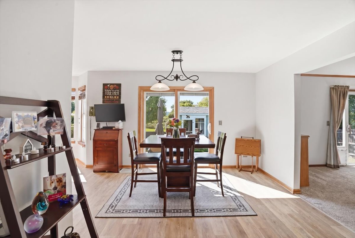 3413 Harbor Ridge Drive Zion, IL 60099 - Photo 13 of 37 a dining room with furniture a chandelier and wooden floor