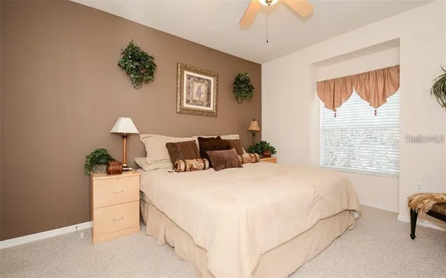 a bedroom with bed and window