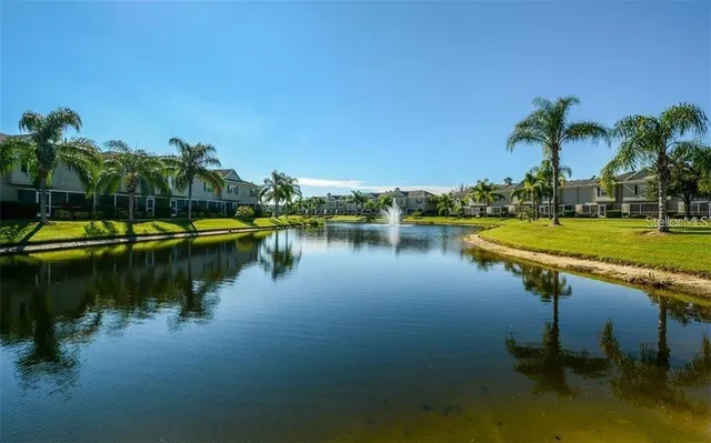 a view of a lake with houses in outdoor space