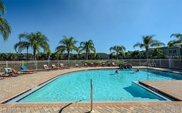 a view of swimming pool with chairs