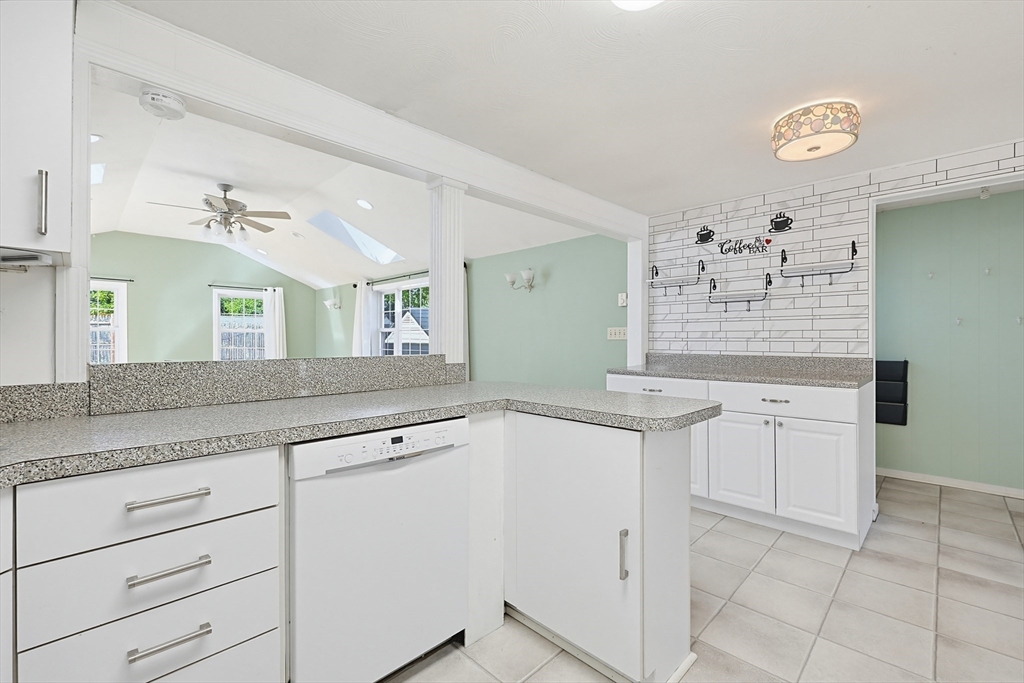 118 Spruce Road Norwood, MA 02062 - Photo 28 of 39 a kitchen with granite countertop cabinets and window