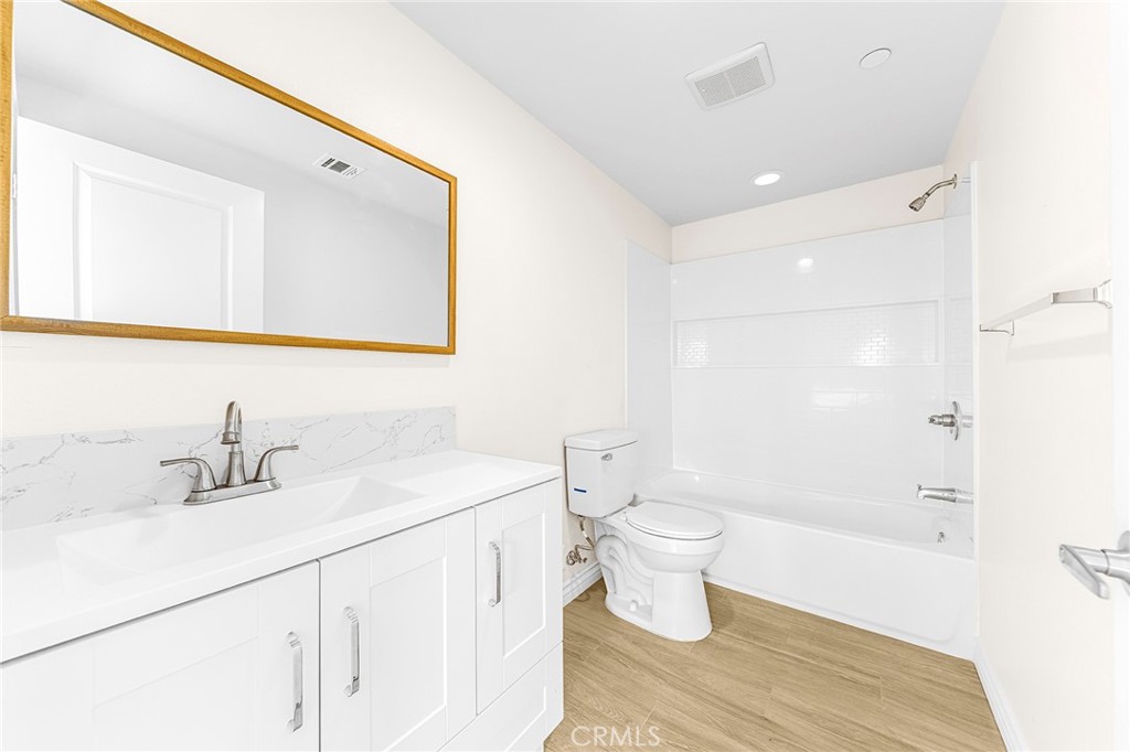 5639 Huntington Drive, Unit 1 Los Angeles, CA 90032 - Photo 13 of 25 a bathroom with a sink and a mirror