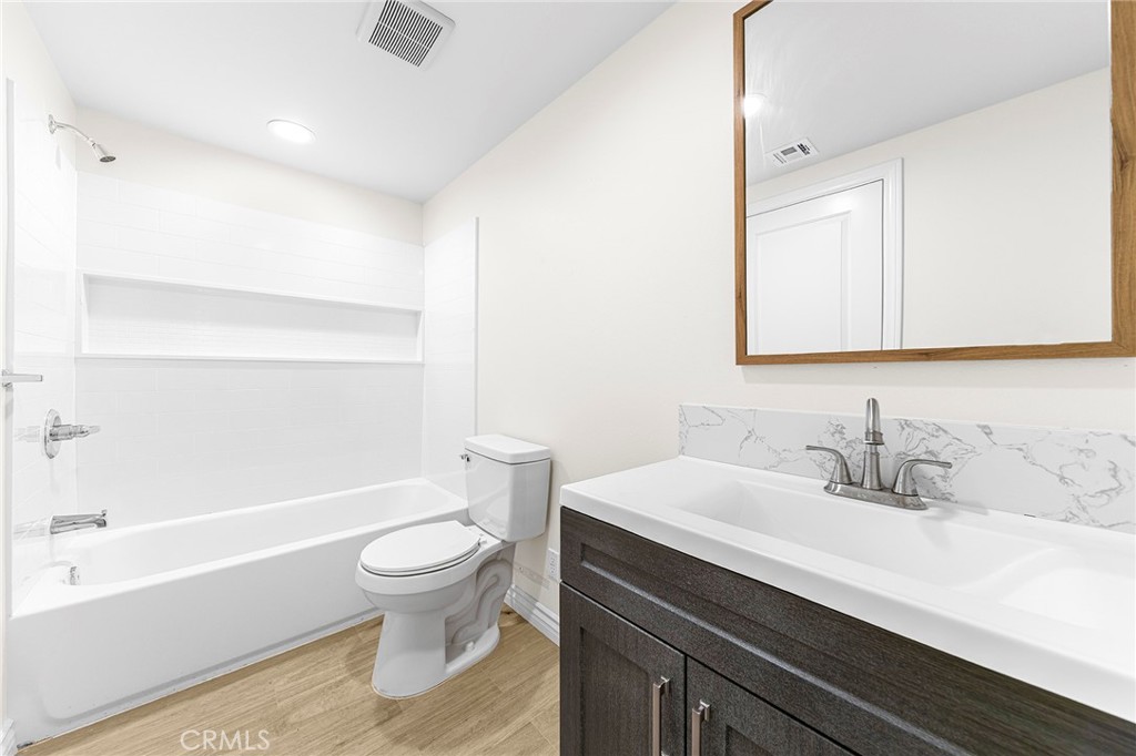 5639 Huntington Drive, Unit 1 Los Angeles, CA 90032 - Photo 17 of 25 a bathroom with a sink a toilet and a bathtub