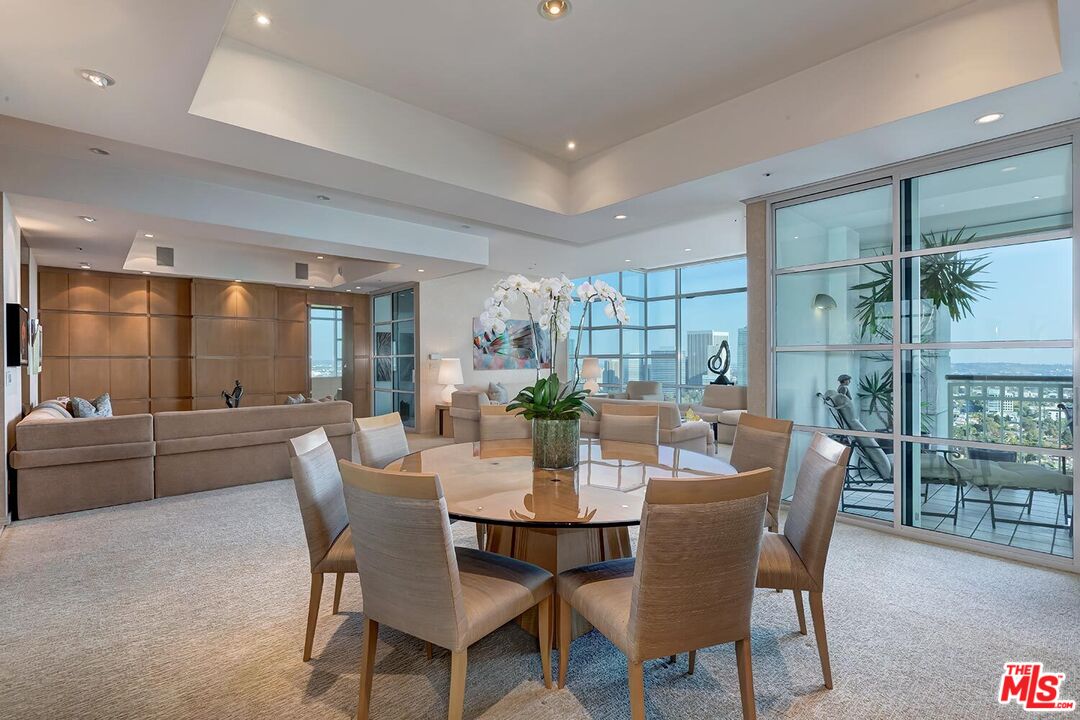 10380 Wilshire Boulevard, Unit 1703 Los Angeles, CA 90024 - Photo 14 of 34 a dining room with furniture a chandelier and wooden floor