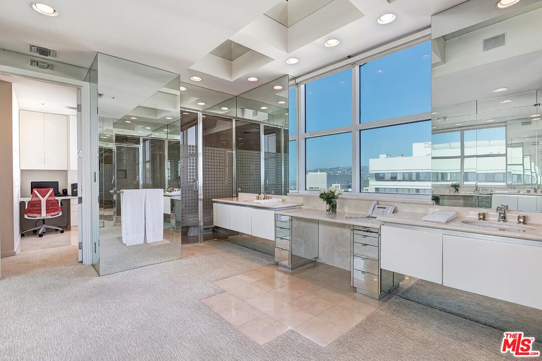 10380 Wilshire Boulevard, Unit 1703 Los Angeles, CA 90024 - Photo 23 of 34 a large white kitchen with a large window
