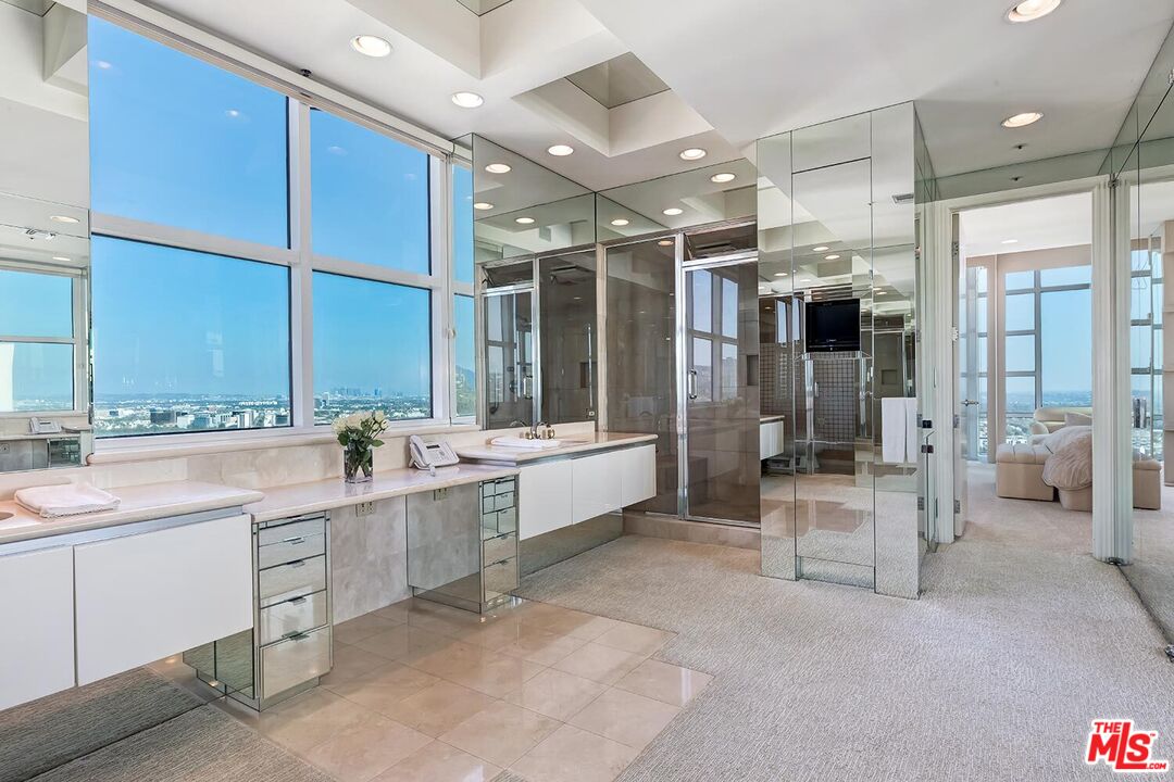 10380 Wilshire Boulevard, Unit 1703 Los Angeles, CA 90024 - Photo 24 of 34 a large en suite bathroom with a large tub and sink
