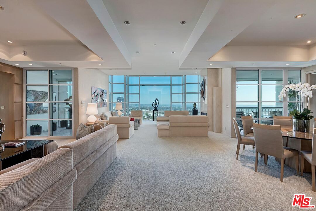 10380 Wilshire Boulevard, Unit 1703 Los Angeles, CA 90024 - Photo 3 of 34 a living room with furniture and a large window
