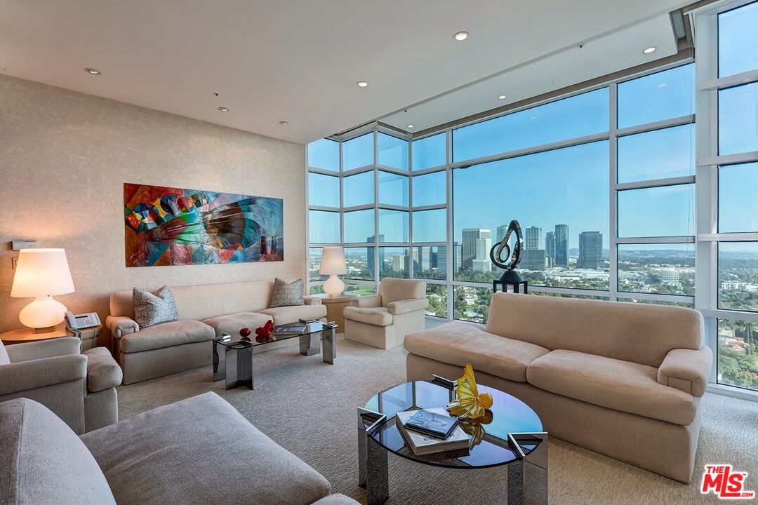 10380 Wilshire Boulevard, Unit 1703 Los Angeles, CA 90024 - Photo 6 of 34 a living room with furniture and a large window