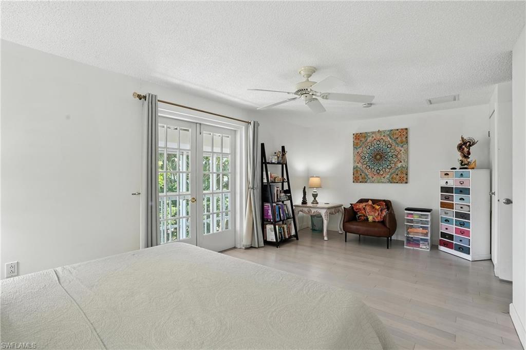 14 Watercolor Way, Unit 14 Naples, FL 34113 - Photo 20 of 37 a view of livingroom with furniture and window