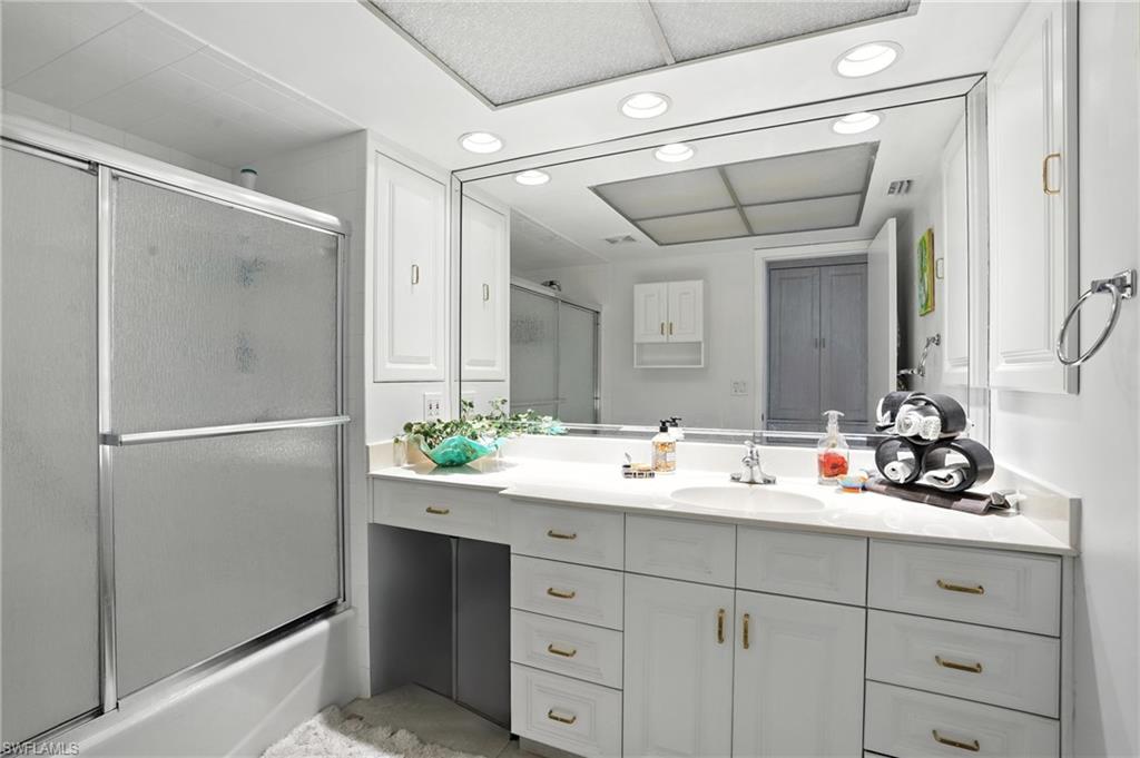 14 Watercolor Way, Unit 14 Naples, FL 34113 - Photo 22 of 37 a bathroom with a double vanity sink mirror and double