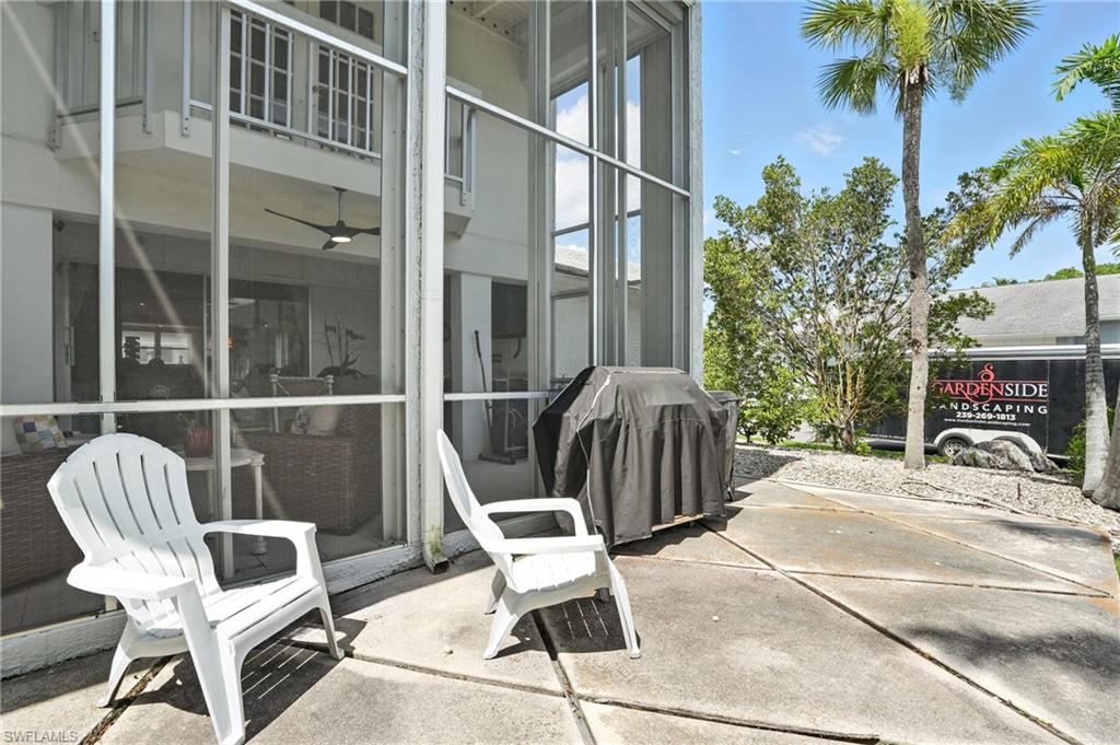 14 Watercolor Way, Unit 14 Naples, FL 34113 - Photo 30 of 37 a view of balcony with two chairs and a potted plant