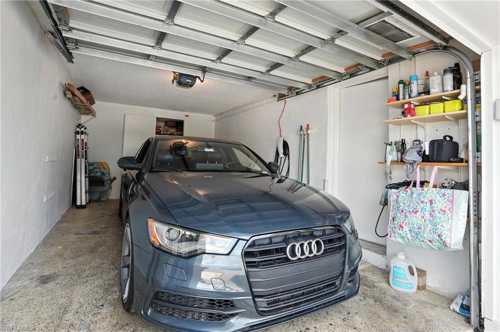 14 Watercolor Way, Unit 14 Naples, FL 34113 - Photo 34 of 37 a car parked in a garage