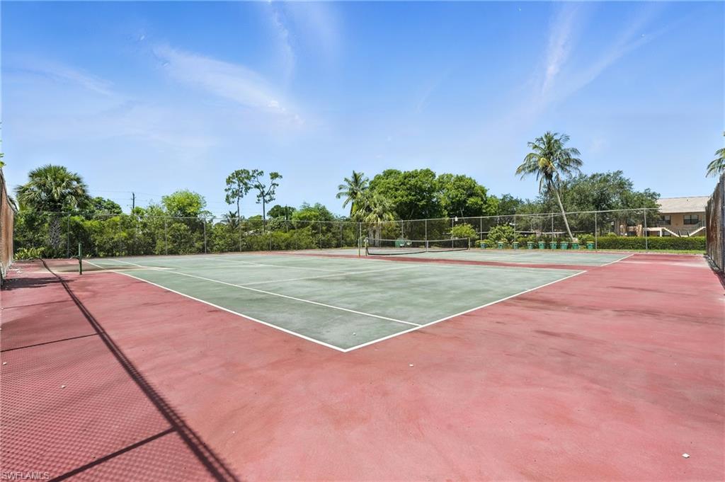 14 Watercolor Way, Unit 14 Naples, FL 34113 - Photo 37 of 37 a view of a tennis court
