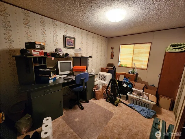 a room with furniture a flat screen tv and a window