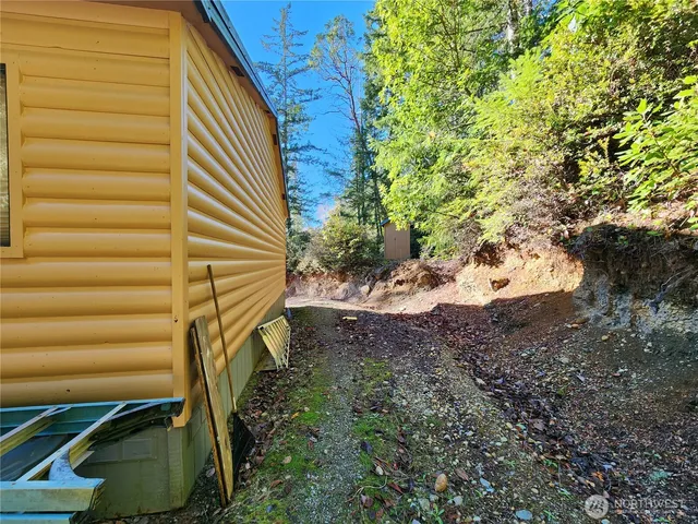 a view of a house with a tree