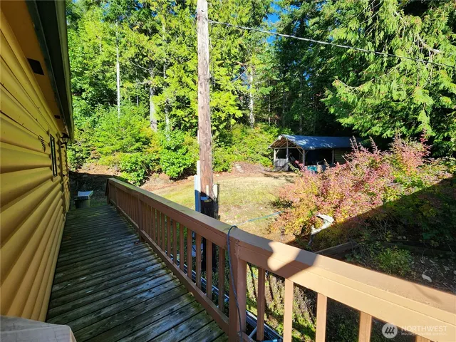 a view of a balcony with two chairs