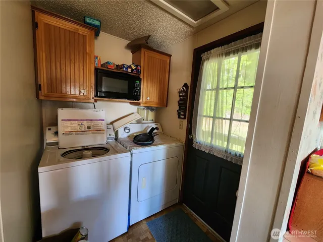 a kitchen with a sink a stove and a refrigerator
