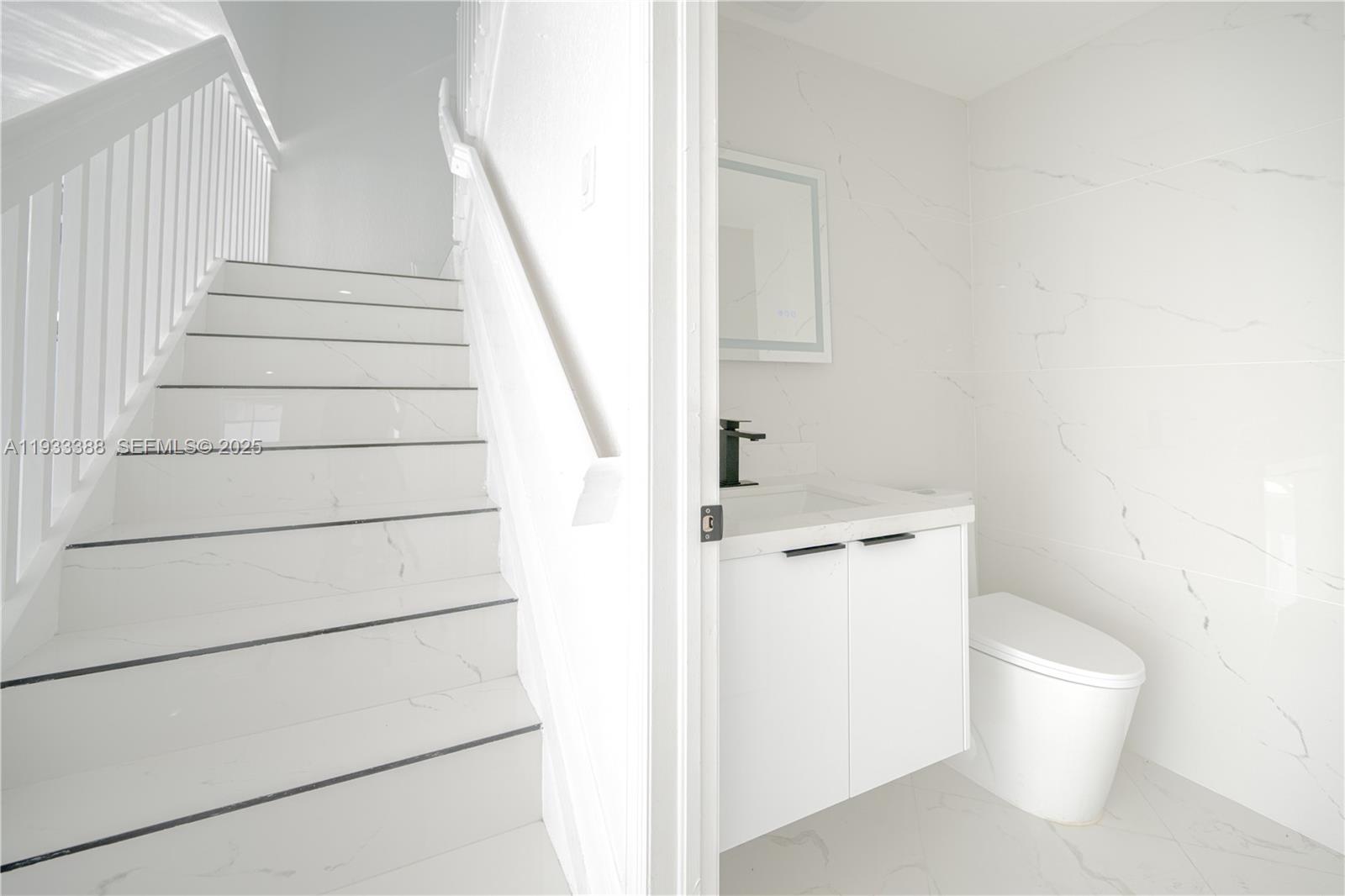 15486 Southwest 23rd Lane Miami, FL 33185 - Photo 14 of 24 a bathroom with a toilet and a shower