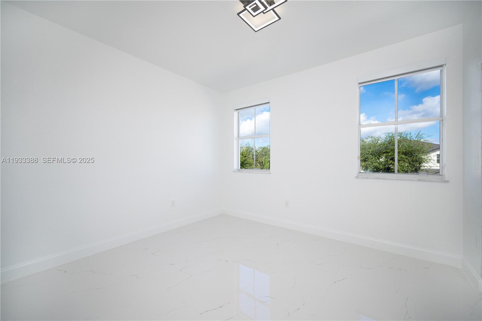 15486 Southwest 23rd Lane Miami, FL 33185 - Photo 22 of 24 an empty room with windows