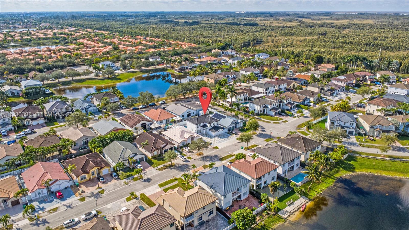 15486 Southwest 23rd Lane Miami, FL 33185 - Photo 6 of 24 an aerial view of residential houses with outdoor space