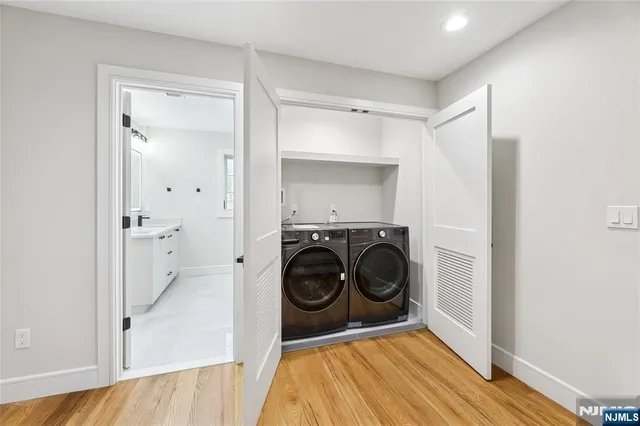 a view of a hallway with washer and dryer