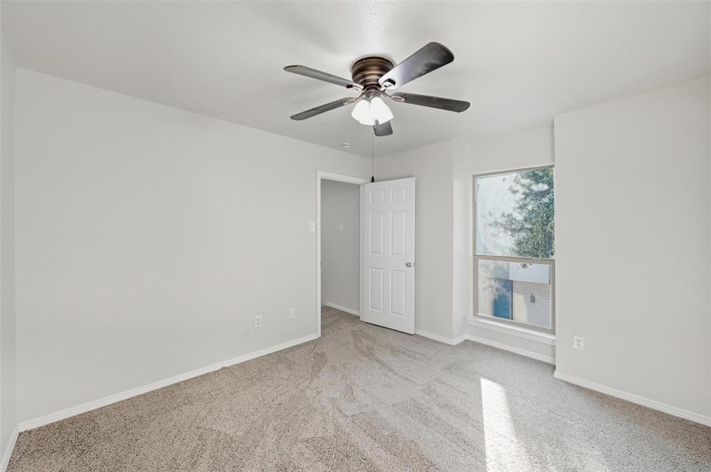 2702 Douglas Avenue, Unit 121 Dallas, TX 75219 - Photo 21 of 34 a view of an empty room with a window
