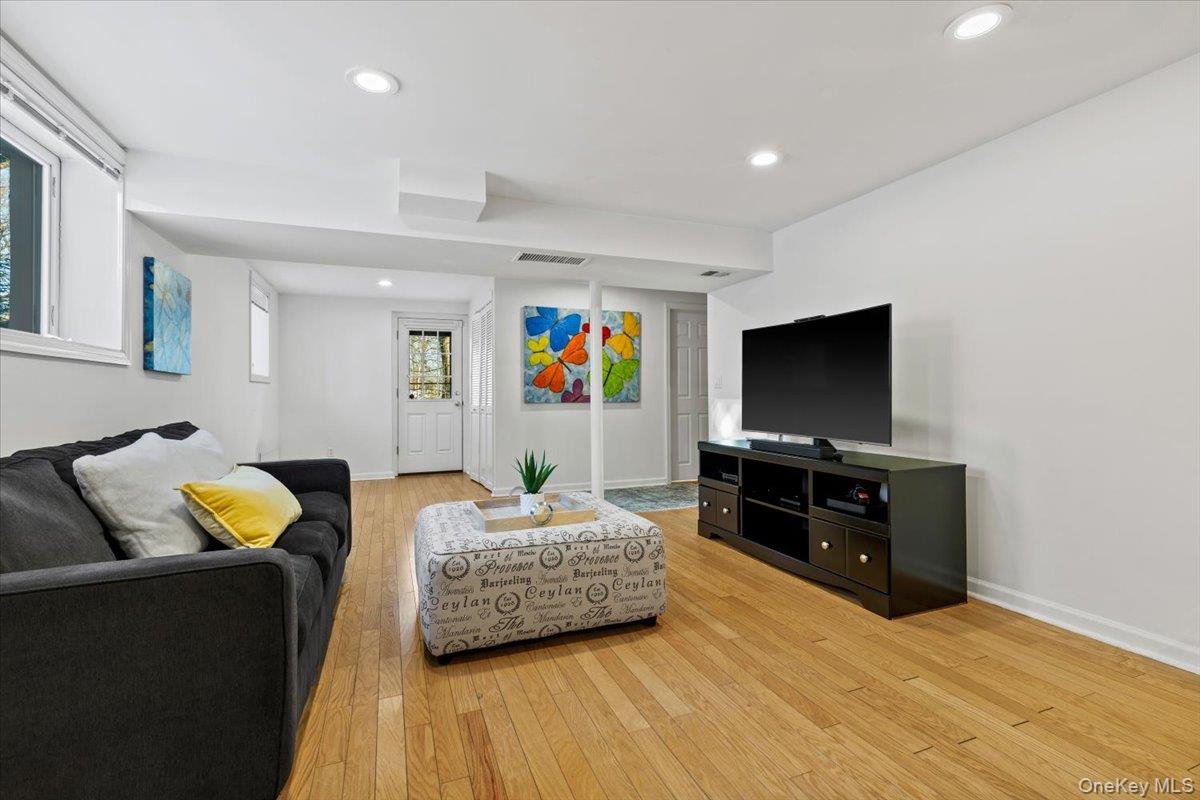 196 Old Army Road Scarsdale, NY 10583 - Photo 18 of 33 a living room with furniture and a flat screen tv