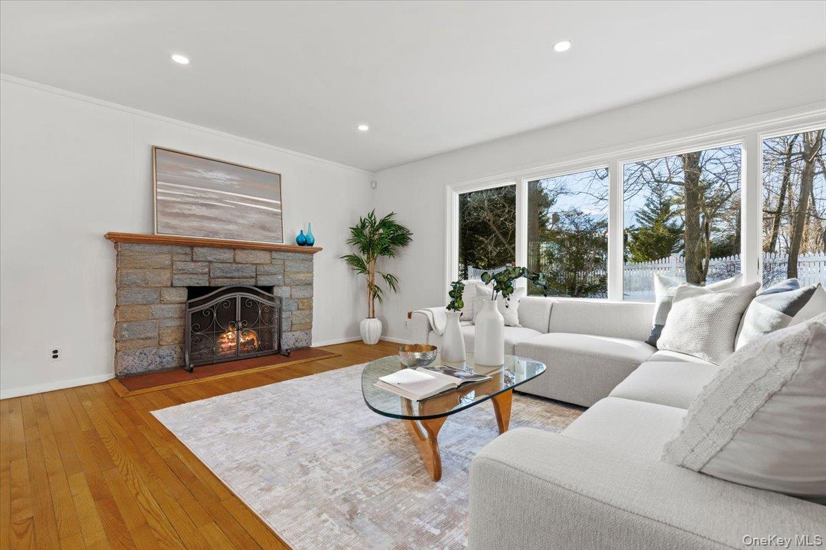 196 Old Army Road Scarsdale, NY 10583 - Photo 2 of 33 Sun-drenched living room with wood-burning fireplace