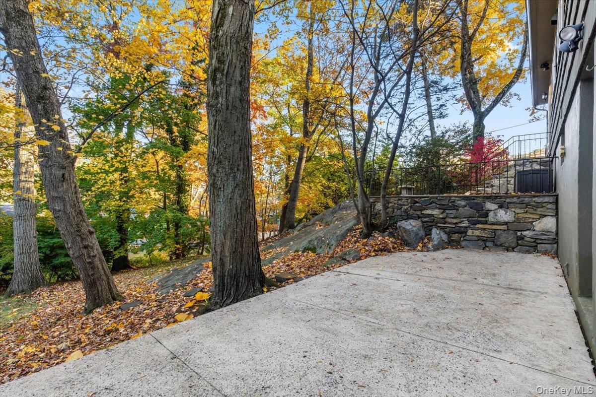 196 Old Army Road Scarsdale, NY 10583 - Photo 5 of 14 Lower patio accessible from lower level family room