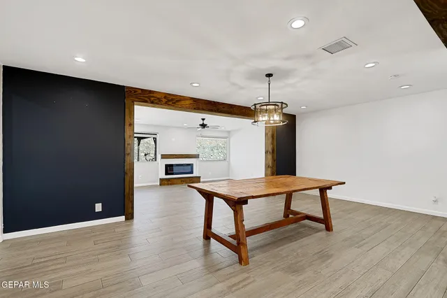 a kitchen with stainless steel appliances granite countertop a refrigerator a sink a stove and oven