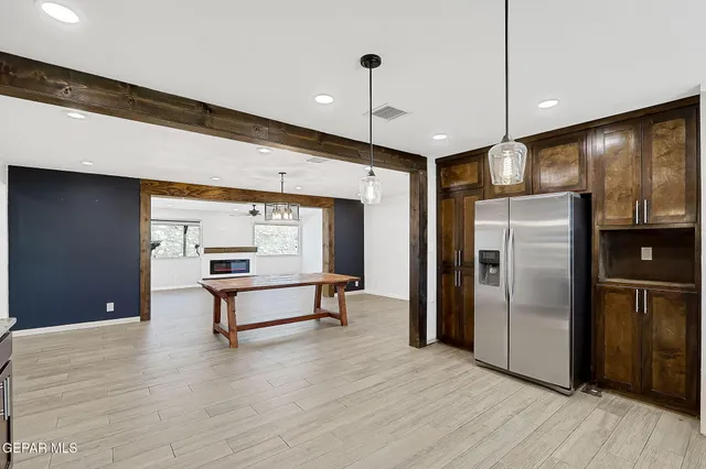 a kitchen with a sink and a wooden cabinets