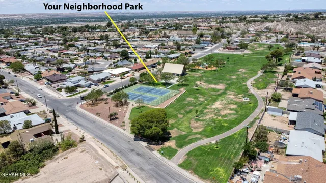 an aerial view of a residential houses with outdoor space