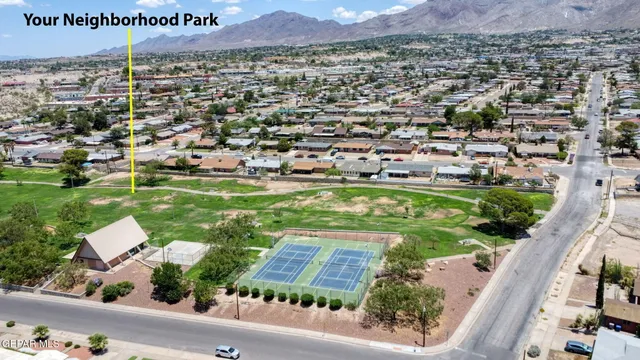 an aerial view of residential house with outdoor space and swimming pool
