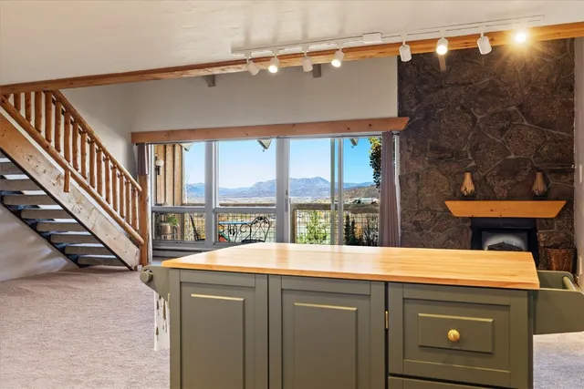 a view of a chairs and table in patio