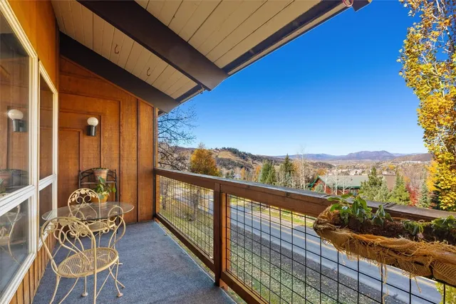 a view of a livingroom with furniture and staircase
