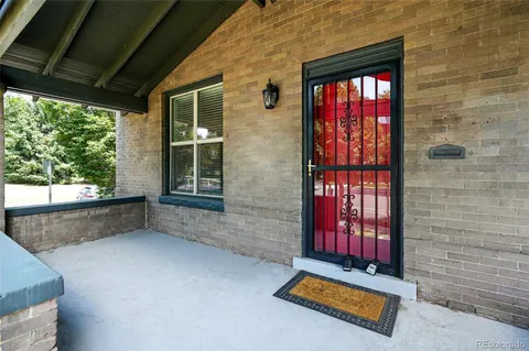 a view of front door with yard