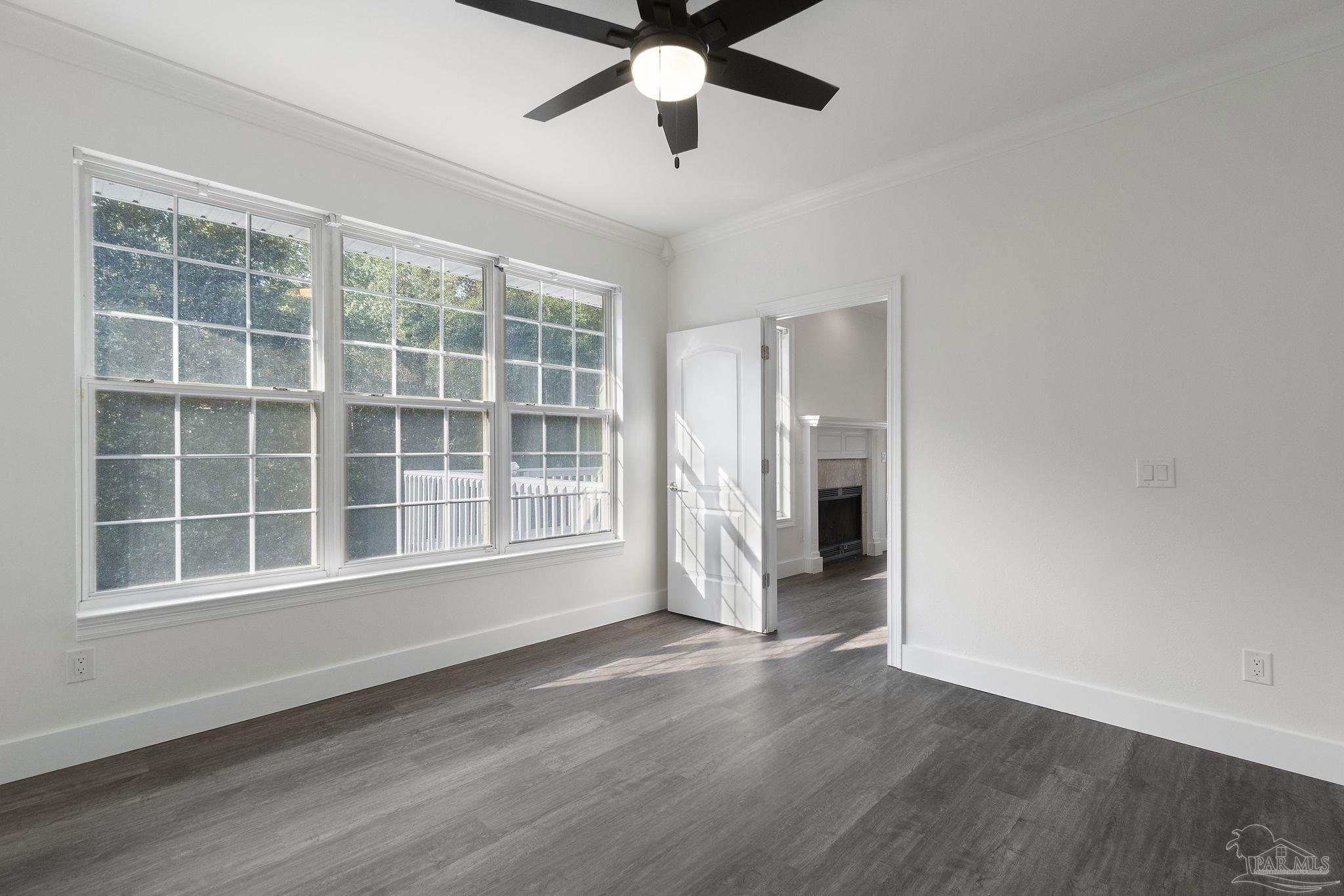 800 Shadow Ridge Drive Pensacola, FL 32514 - Photo 19 of 66 a view of an empty room with a window and wooden floor