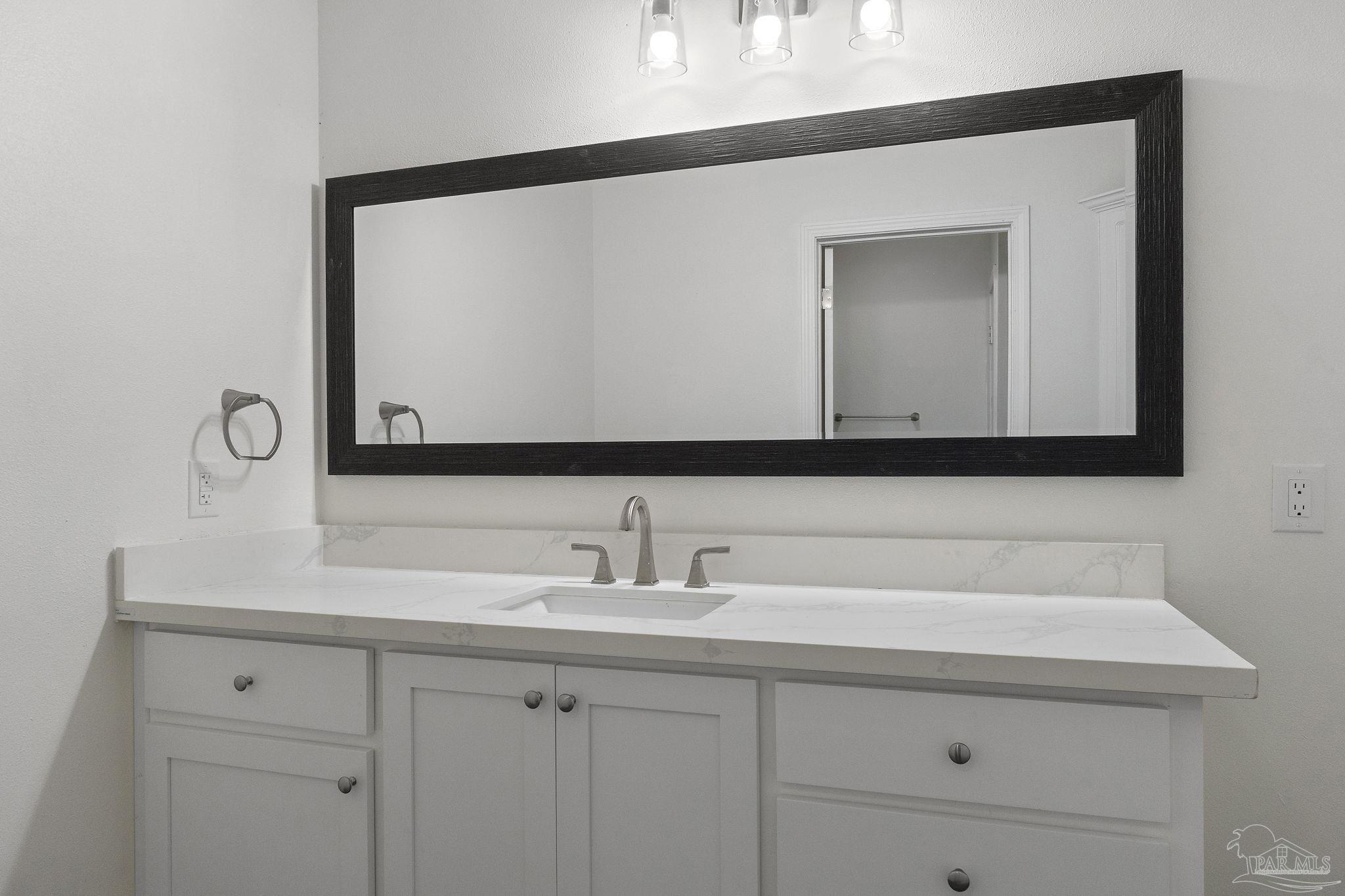 800 Shadow Ridge Drive Pensacola, FL 32514 - Photo 48 of 66 a bathroom with a sink and a mirror