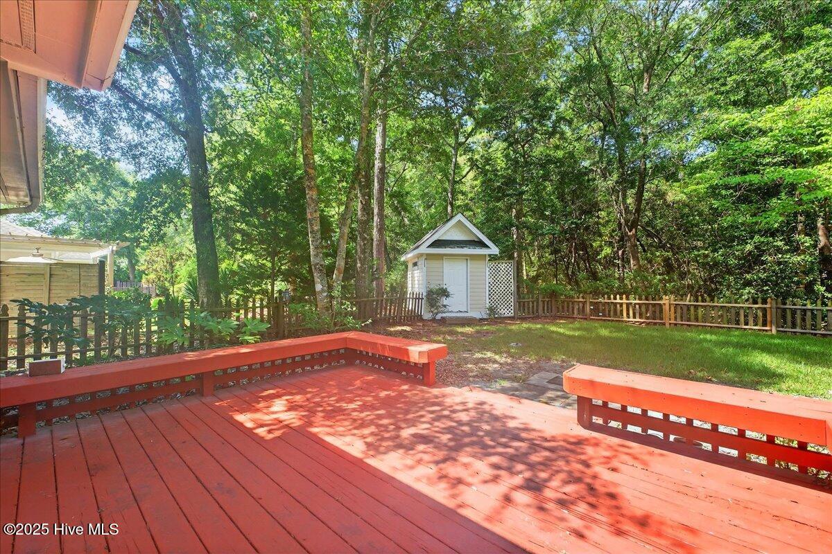 8985 Woodbine Road Southwest Sunset Beach, NC 28468 - Photo 51 of 65 Back deck with view of backyard
