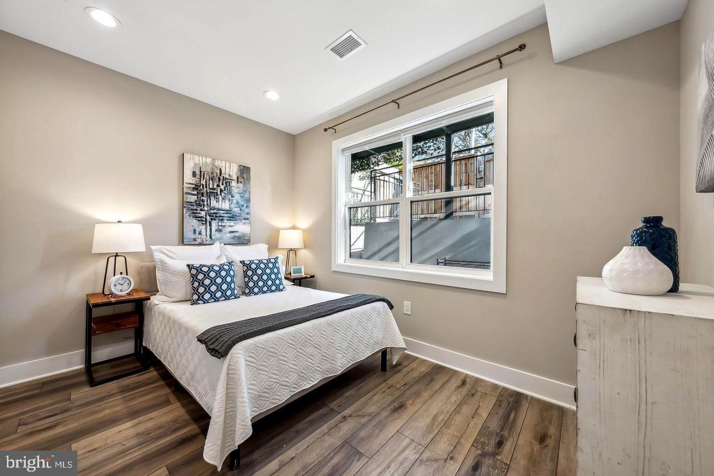1213 Holbrook Street Northeast, Unit 1 Washington, DC 20002 - Photo 11 of 26 a bedroom with a bed and a window