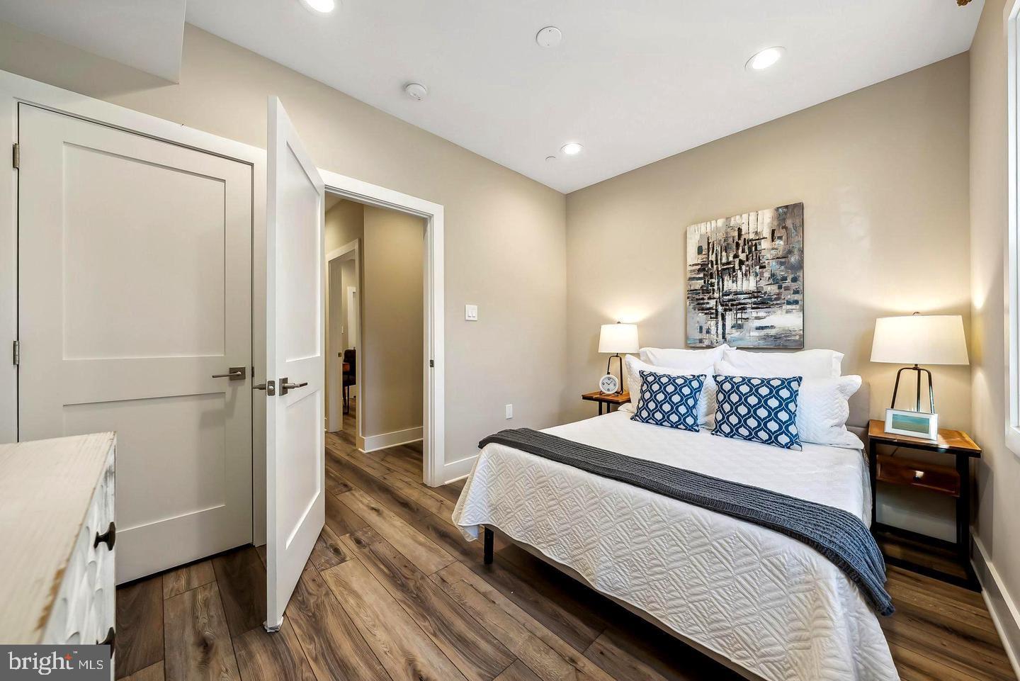 1213 Holbrook Street Northeast, Unit 1 Washington, DC 20002 - Photo 12 of 26 a bedroom with a bed and wooden floor