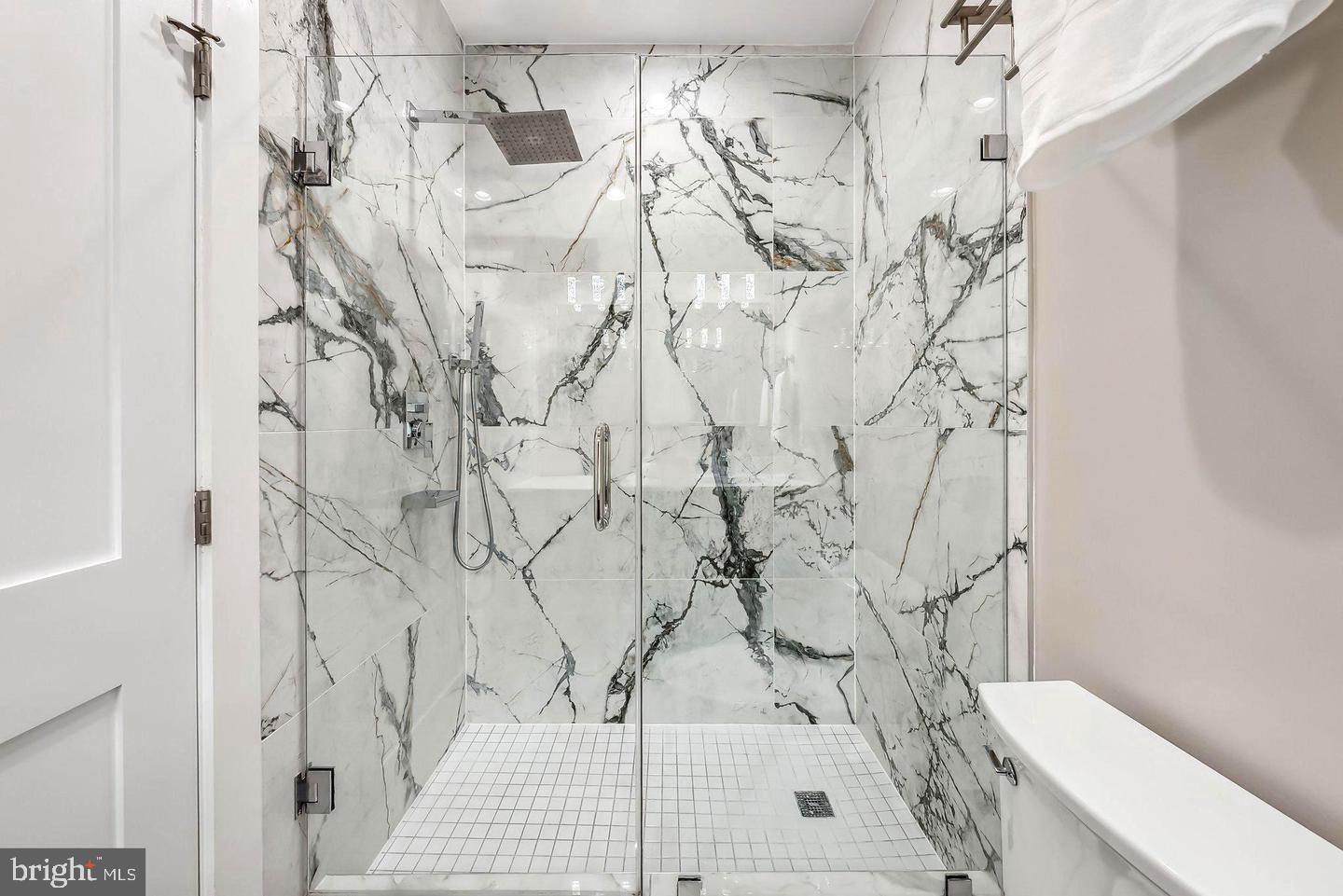 1213 Holbrook Street Northeast, Unit 1 Washington, DC 20002 - Photo 17 of 26 a white bath tub sitting next to a white sink